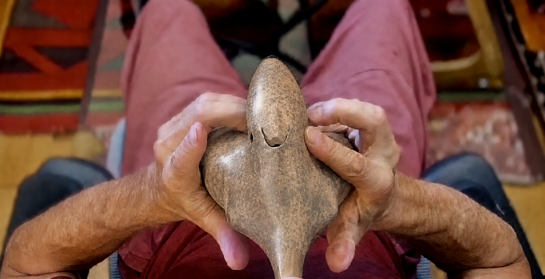 Overhead view of hands playing the Innato